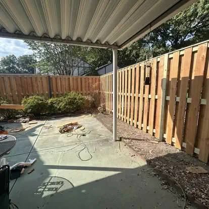 A wood fence with heavy timber framing